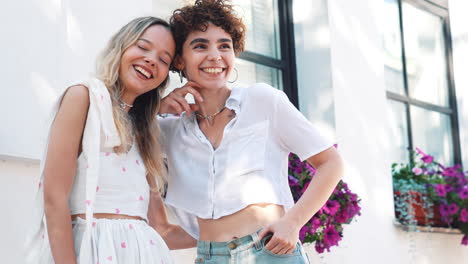 two friends laughing outdoors