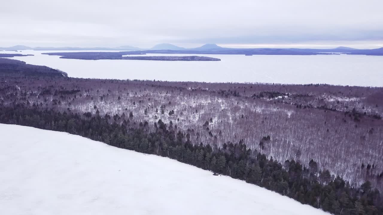 Get an aerial view of Ice Fishing on Fitzgerald Pond, Maine