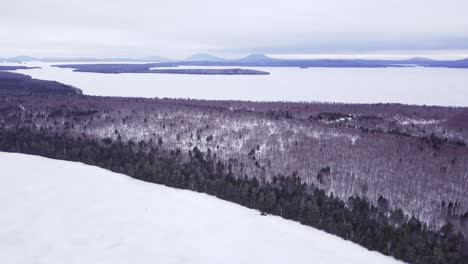 Get-an-aerial-view-of-Ice-Fishing-on-Fitzgerald-Pond,-Maine