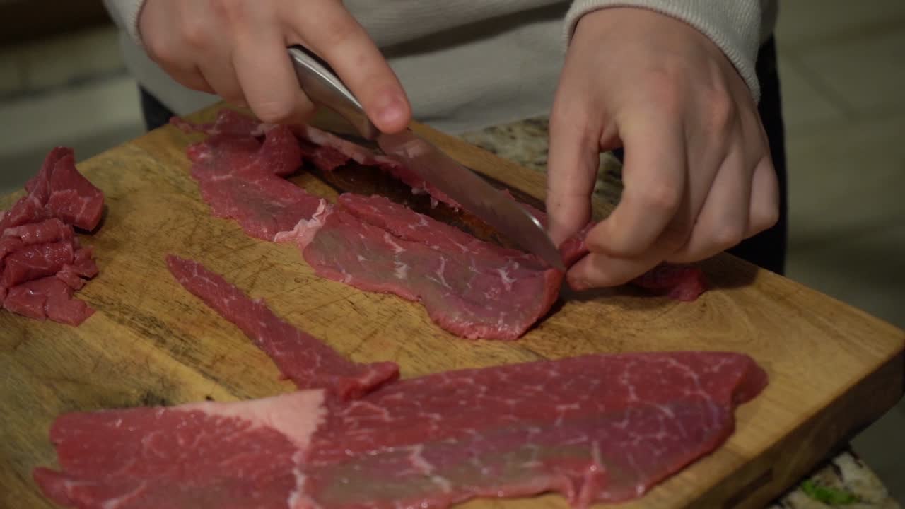 Slicing Steak on a Cutting Board in Slow Motion.