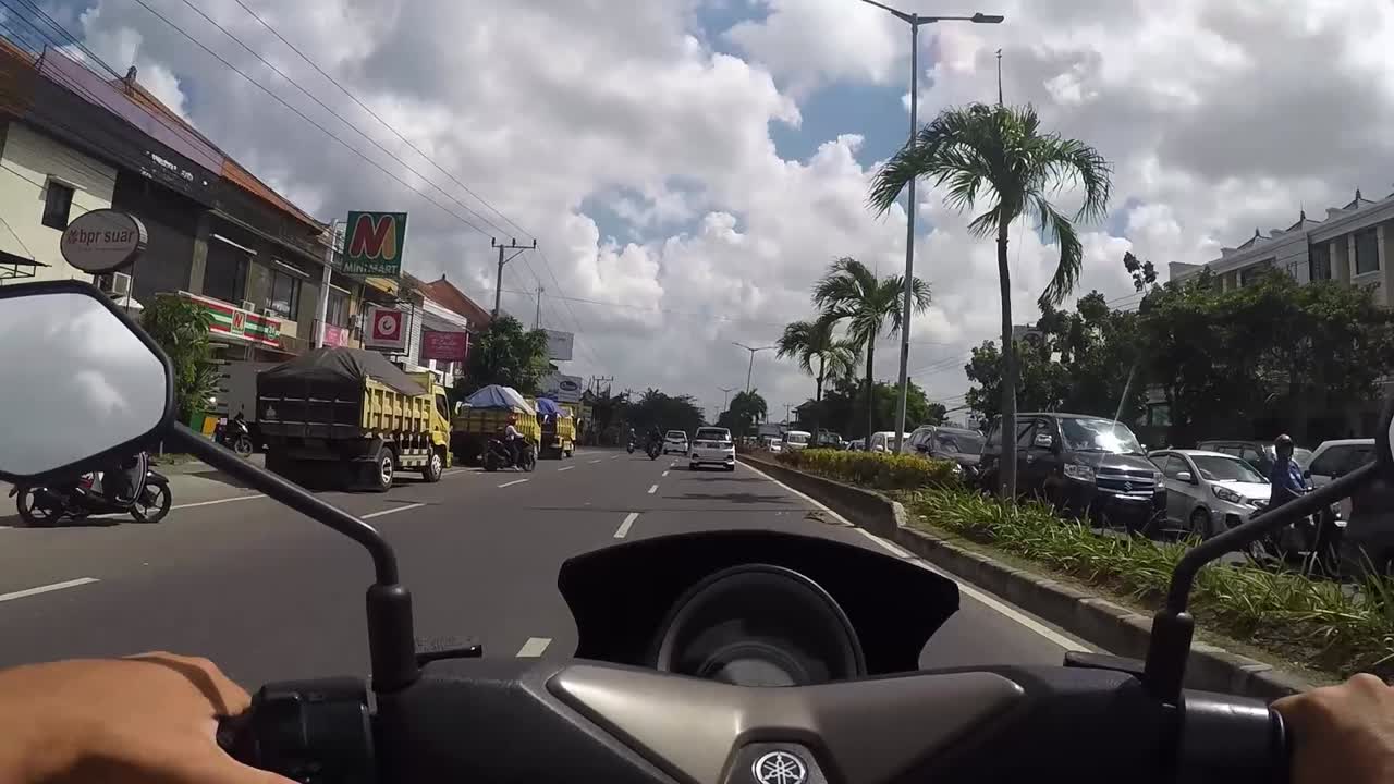 Motorcycle ride on a city street with traffic