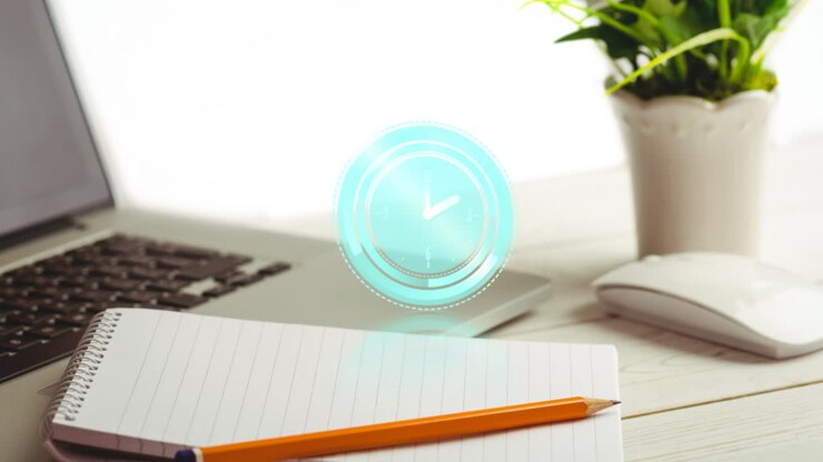 Animation of clock over laptop over desk