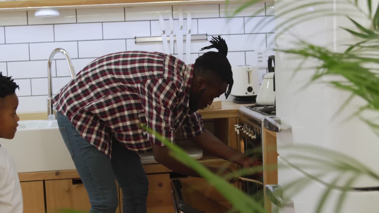 Father and son cooking together