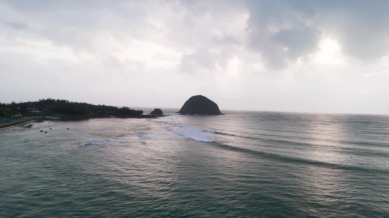 Aerial View Dolly of the Yen Beach and the Mountain at the Sea in the Morning.