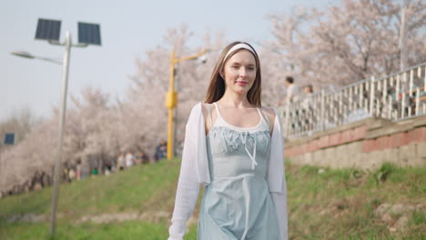 lovely girl walking in the yangjae citizens forest in spring in seocho, seoul, south korea