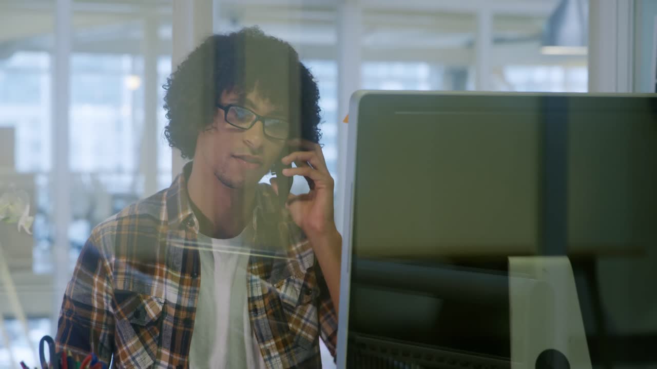 Young man working in a creative office