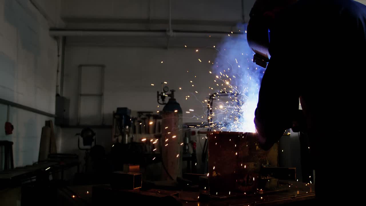 Welder welding a metal