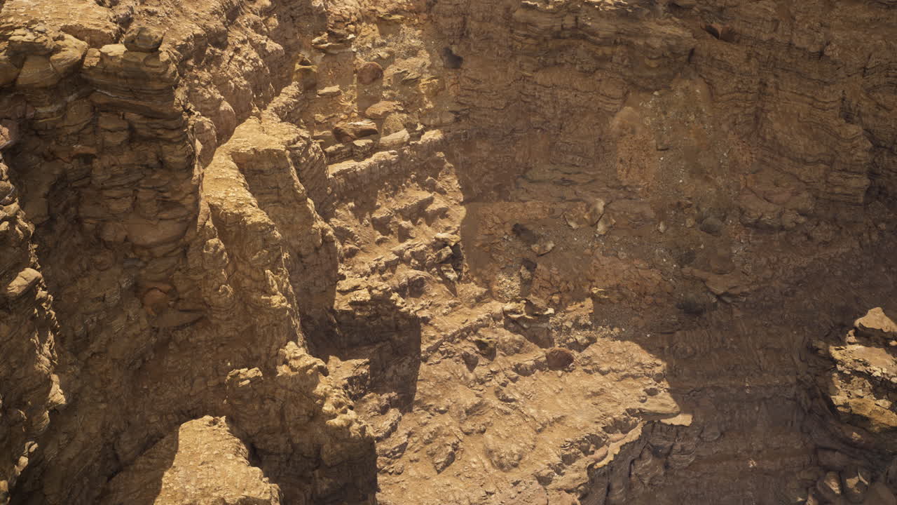 Rocky terrain with cliffs highlighted by afternoon light