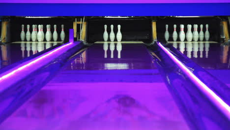 Colorful-bowling-alley.-New-round-in-bowling.-3-pins-waiting-for-new-turn