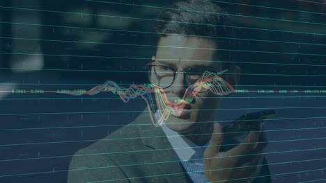 financial market data processing against businessman talking on smartphone