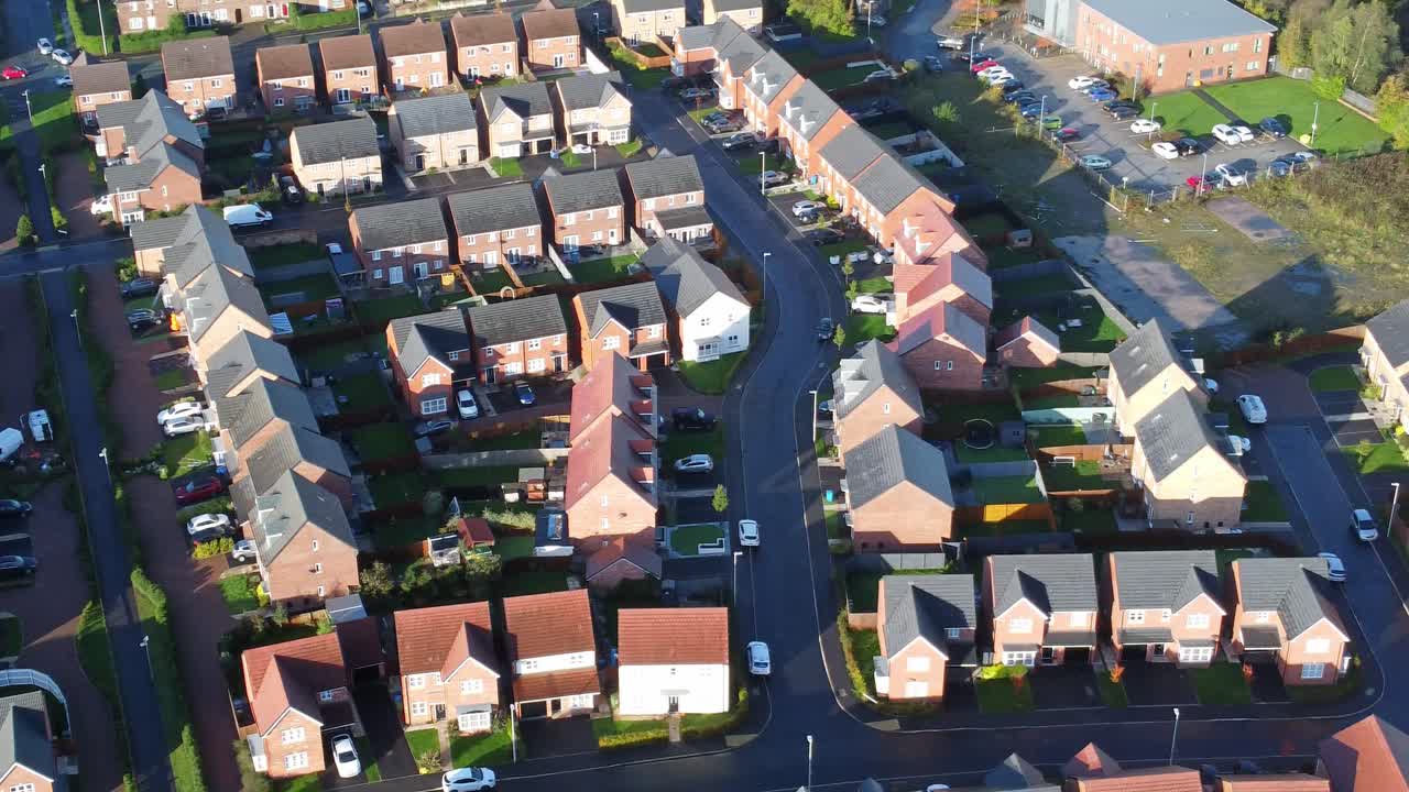 Premium stock video - Aerial view above new build modern housing estate ...