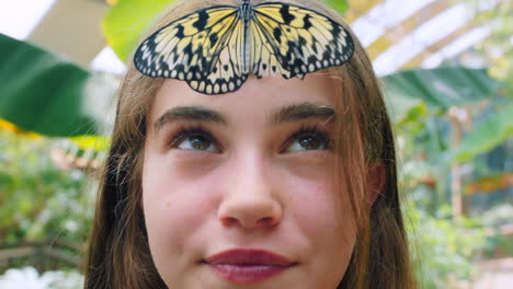 girl with butterfly on forehead