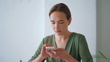 woman ceo typing smartphone closeup. confident corporate manager using mobile