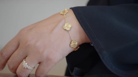 gold bracelet on a woman's hand