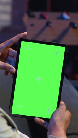 vertical video relaxed male tech user holding device with isolated mockup screen