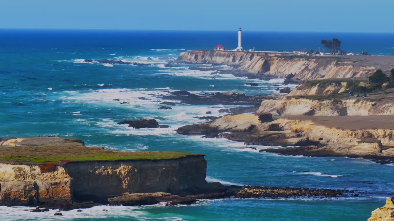 Point Arena Lighthouse Racas Sea Lion Rocks Cove California aerial drone Stornetta coastal Trail Mendocino coast vista point sunny daytime morning afternoon blue sky waves nature circle right parallax