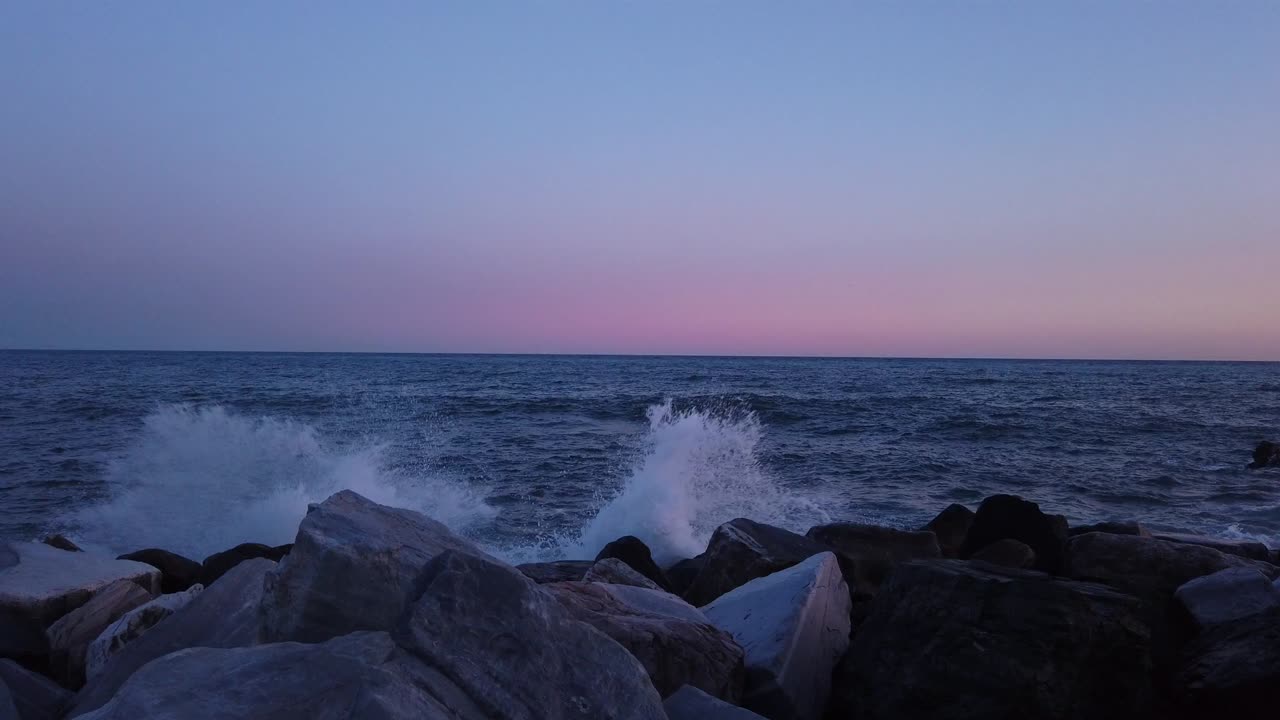 A stunning aerial drone video captures the rustic charm of Italian rooftops. The warm, muted tones and intricate textures create a quaint atmosphere in a historic town with peaceful ambiance