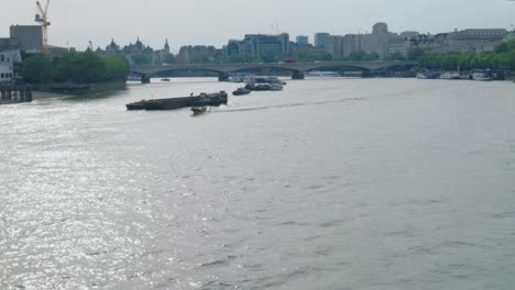 a boat racing on the large river thames