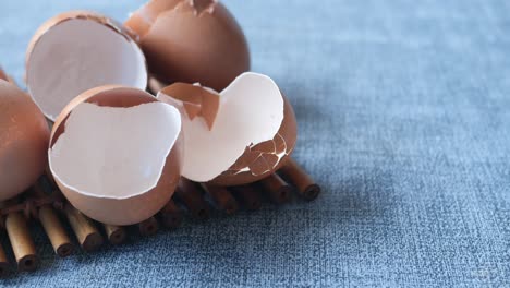 Eggshells-in-a-white--bowl-on-table-,