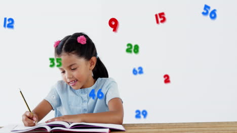 múltiples números y símbolos flotando contra la escritura de la niña de la escuela contra un fondo blanco