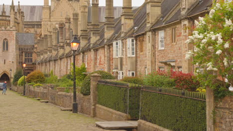 take a stroll down viscar close street in england, where charming architecture meets beautifully manicured gardens and historical wells. experience the serene atmosphere.