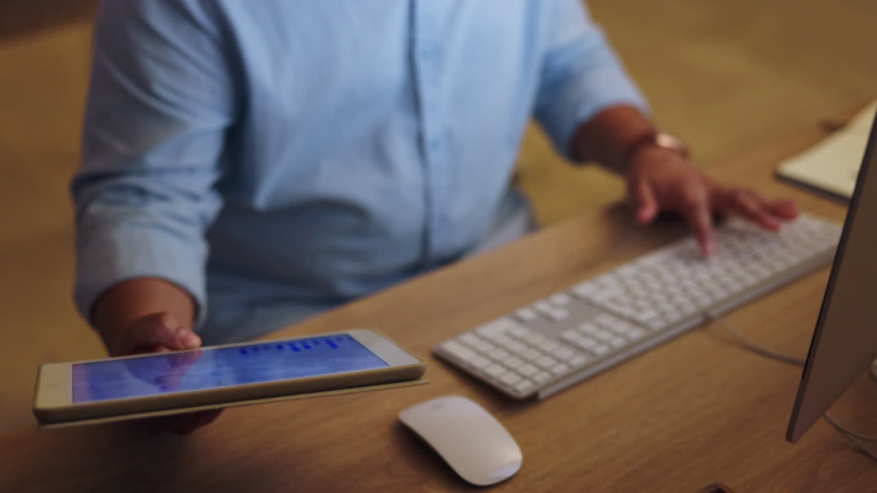 Hands, tablet or man typing on computer in office