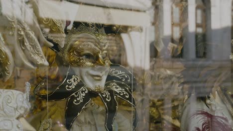 gold-adorned venetian mask on shop window