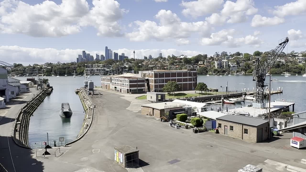 Wide shot of the harbour port area looking towards the CBD city on the historical industrial Cockatoo Island in Sydney harbour, Australia