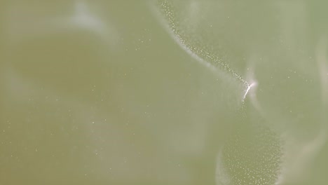 particles slowly moving in abstract water