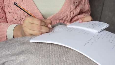 woman writing in a notebook