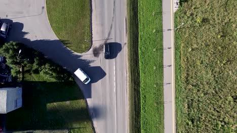 Arial-drone-shot-of-busy-road-and-cars-merging-from-a-turn