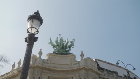 Gorgeous-green-sculpture-on-top-of-the-grand-palace-in-Paris,-focus-rack