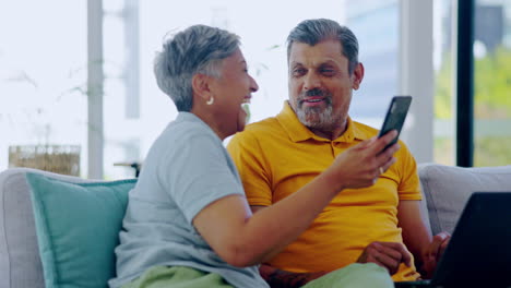 Talking,-phone-and-happy-elderly-couple-laughing