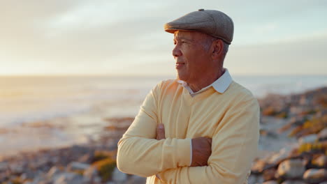 old man, beach and arms crossed