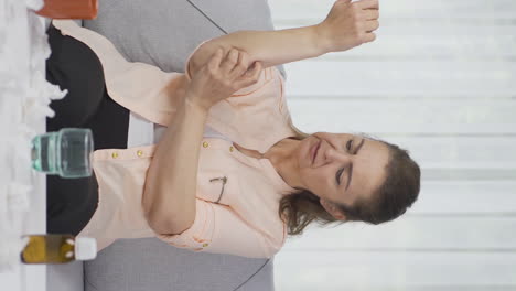 Vertical-video-of-Woman-with-itchy-arms.