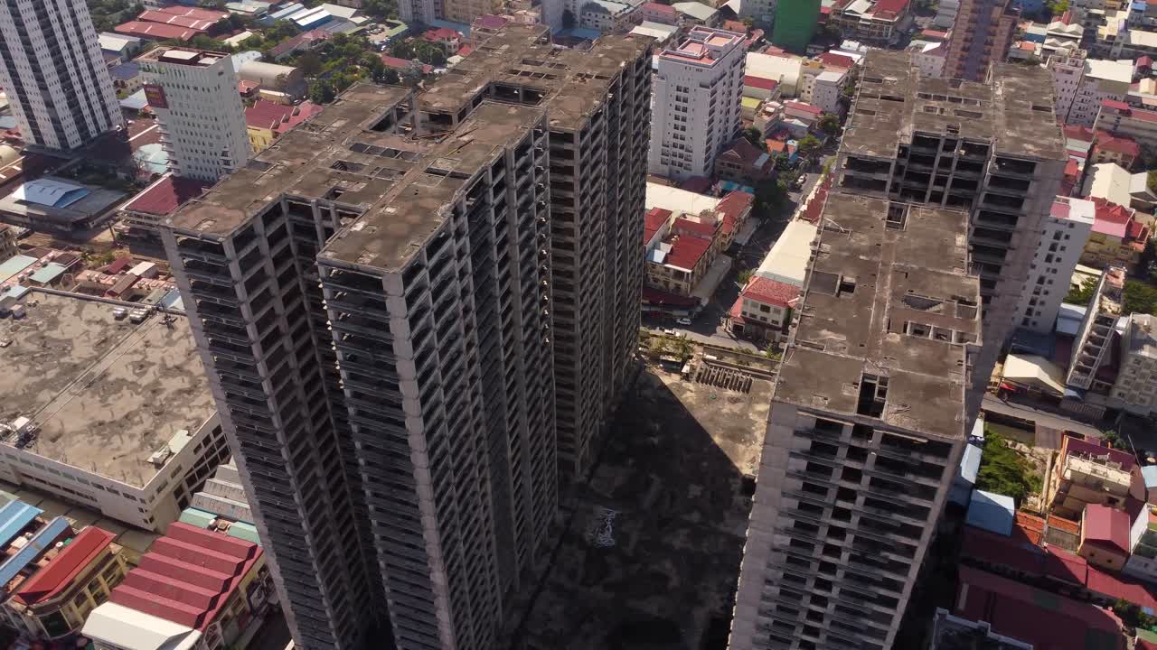 Abandoned unfinished building Phnom Penh Cambodia, aerial drone real estate