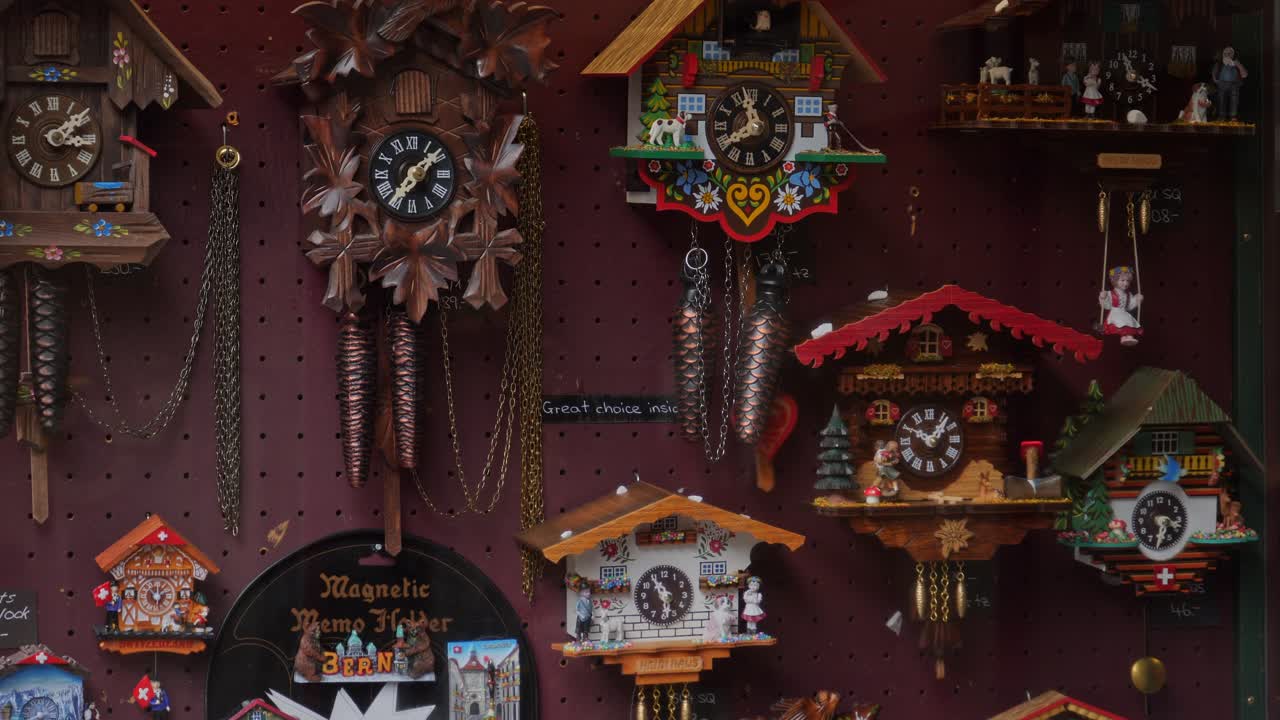 A wall full of working cuckoo clocks