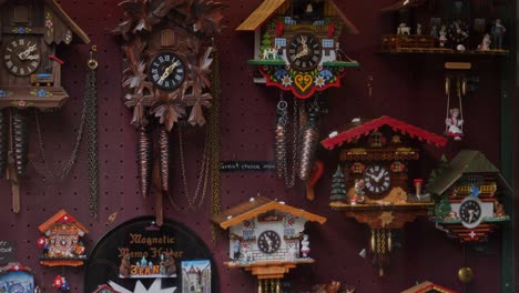 a wall full of working cuckoo clocks