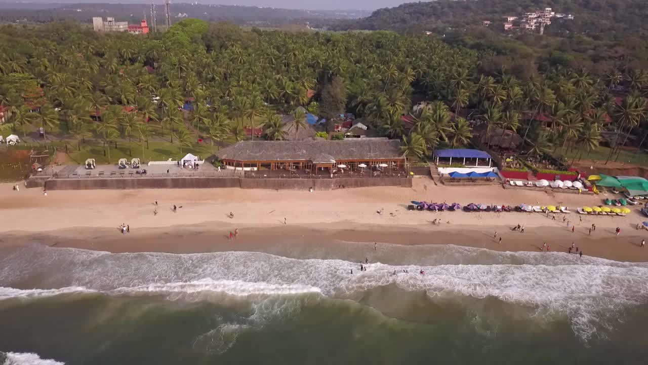 Drone shot flying towards the top of the sea in Goa, India