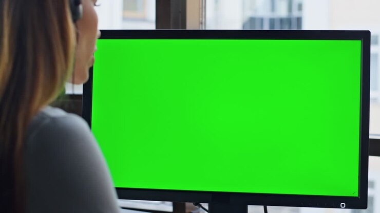 Corporate employee work green computer closeup. Office chroma key equipment.