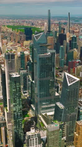 vibrant new york city on amazing sunny day. rising sight of the city, river and docks. vertical video