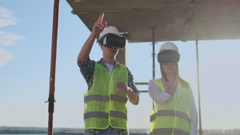 waist up portrait of two modern construction workers using vr gear to visualize projects on site copy space