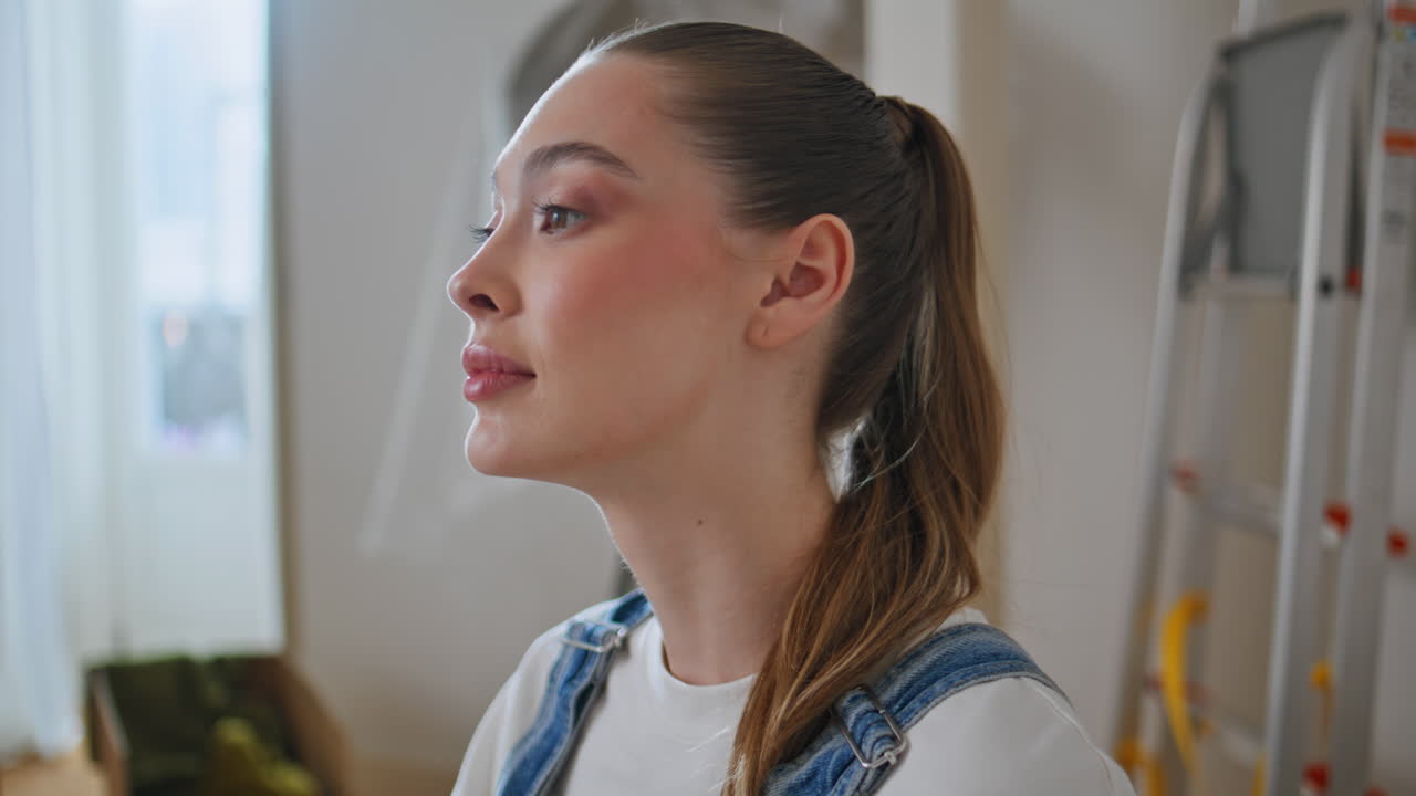 woman posing new apartment looking camera calmly closeup. Relaxed lady