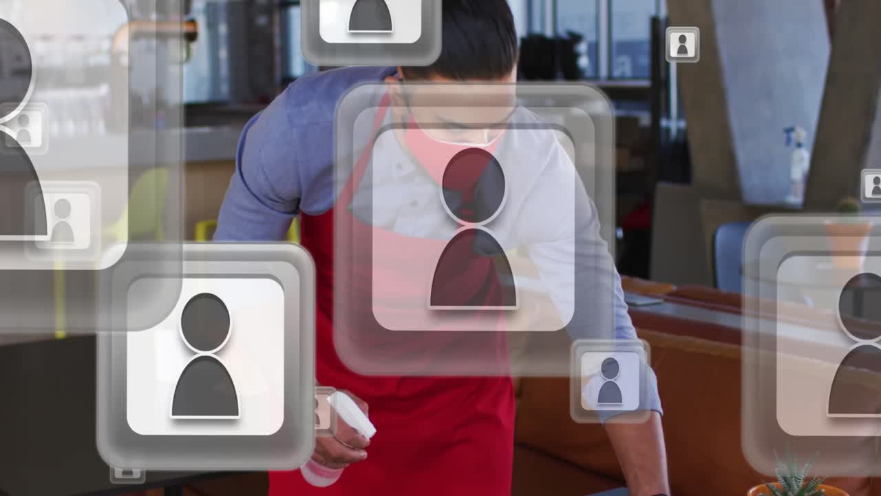 iconos de perfil flotando contra afroamericano camarero de sexo masculino con máscara en la cara limpiando la mesa