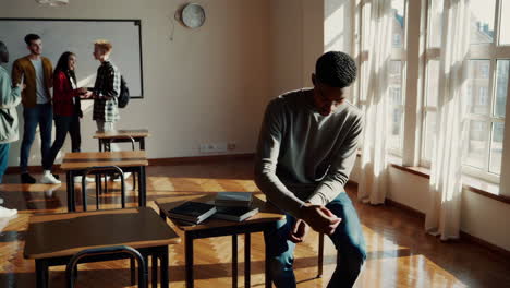 students socializing and preparing in a sunlit classroom