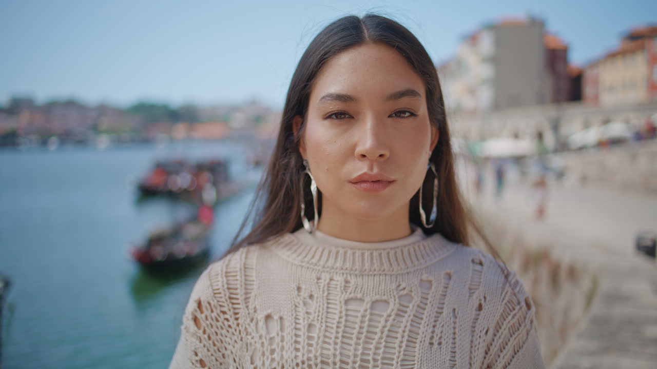 Seductive model posing river view looking camera portrait. a girl face