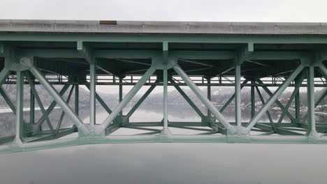 green interstate bridge over lake water