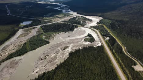 snow melted flood streams in alaska mountains valley by the countryside portage glacier road near trans alaska pipeline