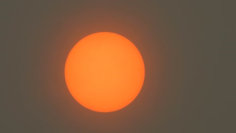 sunlight obscured by sahara dust and wildfire smoke