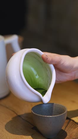 pouring matcha green tea